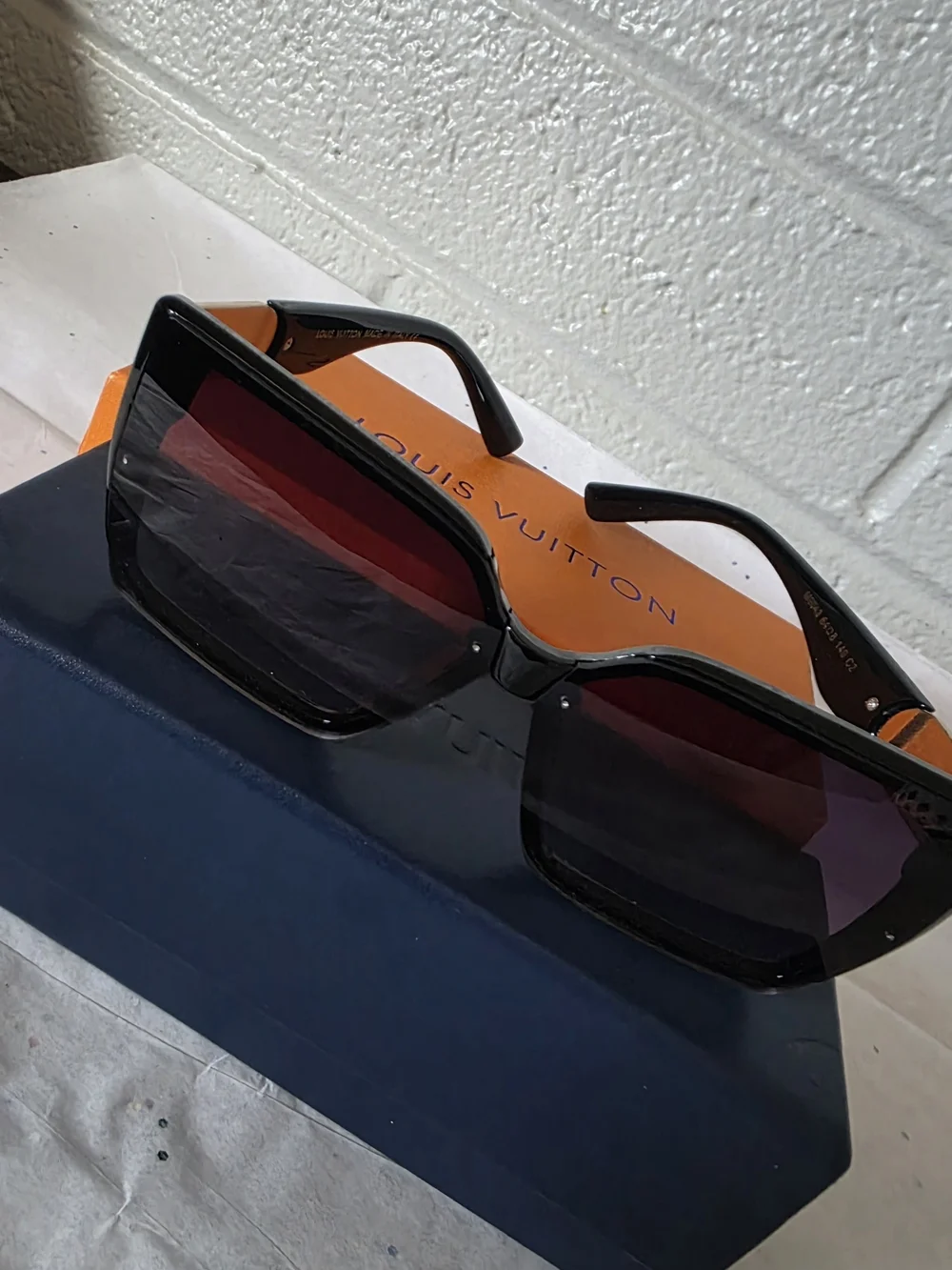 Black Sunglasses with Red-Tint Lenses